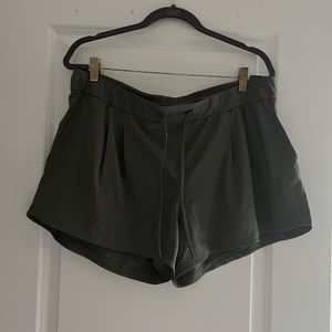 Deep green Lululemon relaxed shorts; size 8